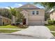 Two-story home with a two-car garage and landscaping at 12307 Duckett Ct, Spring Hill, FL 34610