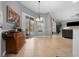 Spacious dining area with sliding glass doors to the pool and seamless flow to the living spaces at 14215 Presteign Ln, Spring Hill, FL 34609