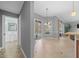 Open dining area offers seamless flow to the breakfast nook, bathroom and living area, promoting a spacious feel at 14215 Presteign Ln, Spring Hill, FL 34609