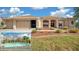 Well-maintained one-story home with beautiful landscaping and inviting curb appeal at 14215 Presteign Ln, Spring Hill, FL 34609