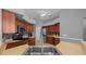 Well-equipped kitchen featuring wood cabinetry, stainless steel appliances, and ample counter space at 14215 Presteign Ln, Spring Hill, FL 34609