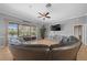 Open living room with tile floors, large sliding doors leading to the outdoor living space at 14215 Presteign Ln, Spring Hill, FL 34609