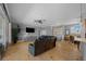 Bright living room with tile floors, view of the front entrance, and dining area at 14215 Presteign Ln, Spring Hill, FL 34609