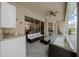 An airy outdoor patio with sleek furnishings, a mini-bar area, and seamless access to the home's interior at 14215 Presteign Ln, Spring Hill, FL 34609