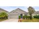 Charming single-Gathering home with a well-manicured lawn and attached two-car garage at 14284 Finsbury Dr, Spring Hill, FL 34609