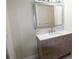 Bathroom featuring white walls, white countertop and modern light-up mirror at 5641 Quist Dr, Port Richey, FL 34668