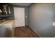 Laundry room featuring a washer, water heater, a door and gray walls at 5641 Quist Dr, Port Richey, FL 34668