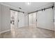Bonus room featuring barn doors and neutral paint tones at 9173 Shadyside Ln, Land O Lakes, FL 34637