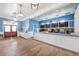 Interior view of the cafe with white counters, blue accent walls and a wood-look floor at 9173 Shadyside Ln, Land O Lakes, FL 34637