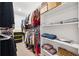 Spacious walk-in closet with custom shelving and ample storage for clothes and accessories at 9173 Shadyside Ln, Land O Lakes, FL 34637