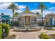 Frontal exterior shot of the Club Connetion building featuring a fountain at 9173 Shadyside Ln, Land O Lakes, FL 34637