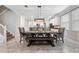 Dining area featuring a large table with statement lighting at 9173 Shadyside Ln, Land O Lakes, FL 34637