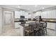 Charming kitchen with granite countertops, stainless steel appliances, and a central island at 9173 Shadyside Ln, Land O Lakes, FL 34637