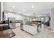 Spacious open concept kitchen, featuring granite countertops, stainless appliances, and dining area at 9173 Shadyside Ln, Land O Lakes, FL 34637