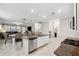 Open concept kitchen with granite countertops, stainless steel appliances, and dining area at 9173 Shadyside Ln, Land O Lakes, FL 34637