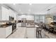 Bright kitchen boasts granite counters, stainless appliances, and an island with seating at 9173 Shadyside Ln, Land O Lakes, FL 34637