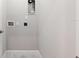 Clean laundry room space with washer and dryer hookups, ready for appliance installation at 9173 Shadyside Ln, Land O Lakes, FL 34637