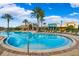 Community pool, featuring a beach entry and views of the clubhouse, perfect for Gathering fun at 9173 Shadyside Ln, Land O Lakes, FL 34637