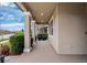 Welcoming front porch featuring classic columns and neutral tones at 9173 Shadyside Ln, Land O Lakes, FL 34637