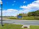 Connerston community entrance with well-manicured landscaping and attractive signage on a sunny day at 9173 Shadyside Ln, Land O Lakes, FL 34637