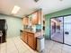 Kitchen with stainless appliances, granite countertops, and access to outdoor patio at 1035 Dockside Dr, Lutz, FL 33559