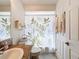 Bathroom featuring granite countertops and a nature-themed shower curtain at 1203 Clays Trl # 406, Oldsmar, FL 34677