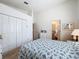 Bedroom with a large closet and an ensuite bathroom featuring white walls at 1203 Clays Trl # 406, Oldsmar, FL 34677