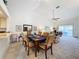 Open-concept dining room with seating for six and sliding doors to an outdoor patio at 1203 Clays Trl # 406, Oldsmar, FL 34677