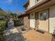 Charming townhouse entrance featuring a brick walkway, well-maintained landscaping, and a bright front door at 1203 Clays Trl # 406, Oldsmar, FL 34677