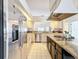 Modern kitchen equipped with stainless steel appliances, sleek countertops, and ample cabinet storage at 1203 Clays Trl # 406, Oldsmar, FL 34677