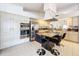 Bright and modern kitchen with stainless appliances, granite counters, and a functional island with seating at 1203 Clays Trl # 406, Oldsmar, FL 34677