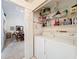 Laundry room with washer, dryer, and built in shelves for storage at 1203 Clays Trl # 406, Oldsmar, FL 34677