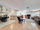Open-concept living area showcasing a seamless blend of kitchen and living spaces on tile floors at 1203 Clays Trl # 406, Oldsmar, FL 34677