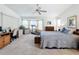 Bright and airy bedroom featuring a bay window, desk, and comfortable furnishings at 1203 Clays Trl # 406, Oldsmar, FL 34677