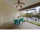 Enclosed patio overlooking a tranquil pond, perfect for relaxation and enjoying nature at 1203 Clays Trl # 406, Oldsmar, FL 34677