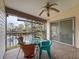 Enclosed patio with furniture overlooking a tranquil pond and beautiful foliage at 1203 Clays Trl # 406, Oldsmar, FL 34677