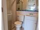 Cozy bathroom with glass shower, mosaic accents, and vanity at 13637 Lagoon Dr, Hudson, FL 34667