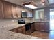 Bright and airy kitchen featuring granite countertops and modern appliances at 13637 Lagoon Dr, Hudson, FL 34667