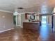 Open concept living room and kitchen with tile floors at 13637 Lagoon Dr, Hudson, FL 34667