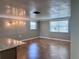 Bright living room featuring tile floors, natural light, and stylish lighting fixtures at 13637 Lagoon Dr, Hudson, FL 34667