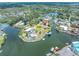 Aerial shot of waterfront property with surrounding waterways and mature trees at 14124 Kulig Ct, Hudson, FL 34667
