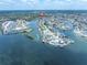 Expansive aerial view showcases the waterfront property with its scenic canals and boat docks at 14124 Kulig Ct, Hudson, FL 34667