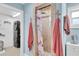Updated bathroom features a tiled shower with flamingo accents and laundry area at 14124 Kulig Ct, Hudson, FL 34667