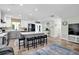 Stylish kitchen with a large center island, white and gray cabinetry, and tile flooring at 14124 Kulig Ct, Hudson, FL 34667