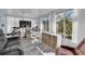 Bright sun room with large windows, comfortable seating, and a view of the outdoors at 14124 Kulig Ct, Hudson, FL 34667