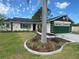 Charming single-story home featuring a landscaped front yard and an attached two-car garage at 4649 Westerly Dr, New Port Richey, FL 34653