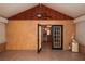 Open glass paneled doors reveal the kitchen from the sunroom with tile flooring at 4649 Westerly Dr, New Port Richey, FL 34653