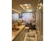 Bathroom features vanity with sink, mirror, cabinet, toilet, and decorative shower curtain at 9741 Star Trl, New Port Richey, FL 34654