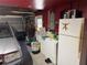 Attached garage featuring laundry area, storage shelves, and car parking at 9741 Star Trl, New Port Richey, FL 34654