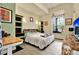 Cozy bedroom with ample light, modern furniture and stylish decor at 10030 Orchard Way, Spring Hill, FL 34608